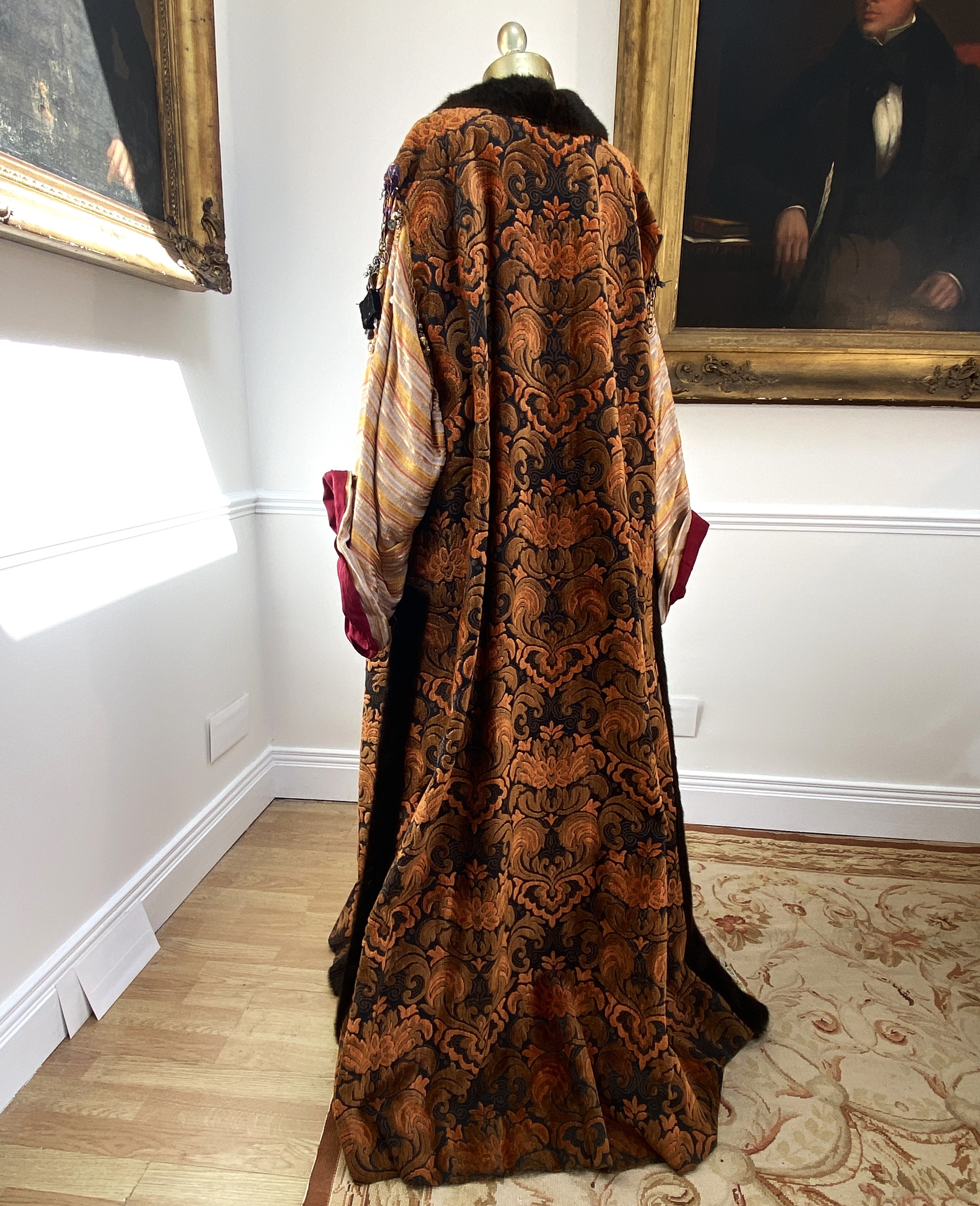 A men’s brocade robe with imitation fur edging and ethnic metal decorations, and orange/black under-garment, labelled Royal Opera House ‘Clamenza di Tito’ – Hebrew Dignity